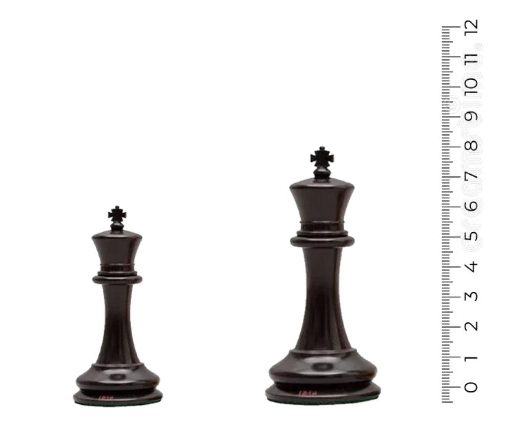 Two black chess king pieces of different sizes next to a measuring tape displaying their heights between 2.36 to 3 inches.