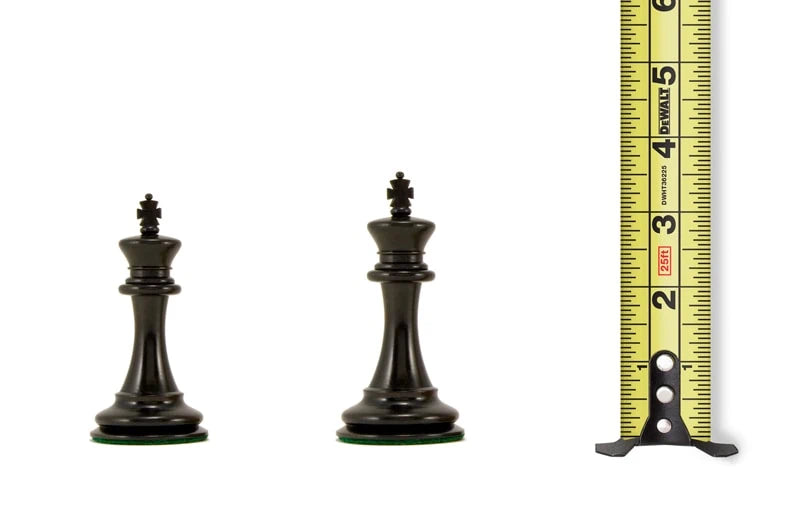 Black chess king and queen pieces next to a tape measure showing heights of 3.25 to 3.5 inches