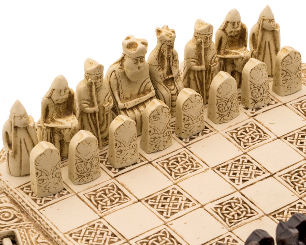 Isle of Lewis Compact Celtic Chess Set 9 Inches in Ivory with miniature chessmen and stoneware board close-up