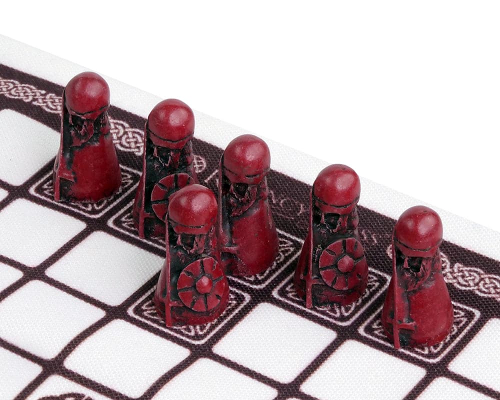 Red attacking pieces on the screen-printed linen playing surface of Hnefatafl, The Viking Game - Cardinal Edition