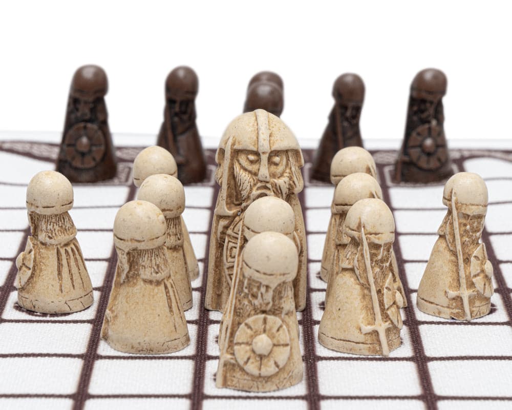 Hnefatafl board game with intricately designed ancient Viking chess pieces on a checkered board