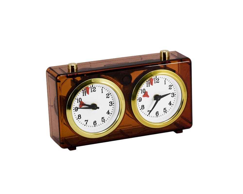 Traditional Turnier chess clock with amber plastic casing and wind-up mechanism