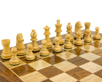 Down Head Knight Ebonised Staunton chess pieces 2.5 inches on wooden chessboard