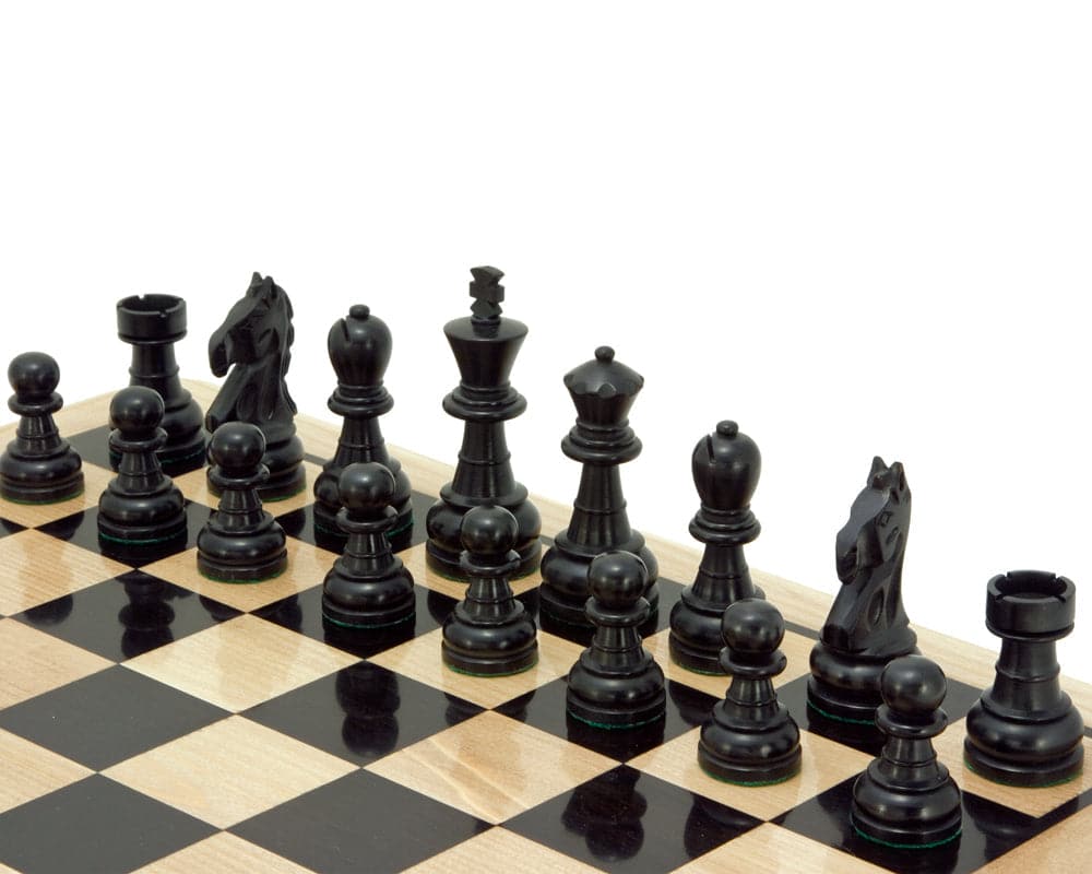 Emerald Series Ebonised Boxwood Chess Pieces on a chessboard, featuring a 3.25-inch king and perfect for 18 or 19-inch boards.