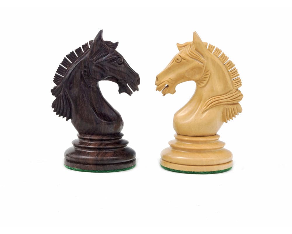 Ornate rosewood and boxwood knight chess pieces from Luxury Staunton Garvi set, featuring intricate Mughal-influenced carvings.