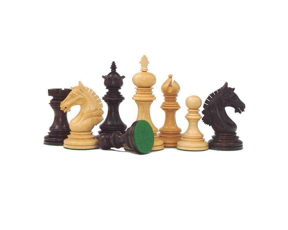 Luxury Staunton Garvi 4.25 inch Rosewood Chessmen set on display, featuring intricately carved Mughal-influenced chess pieces with felt bases.