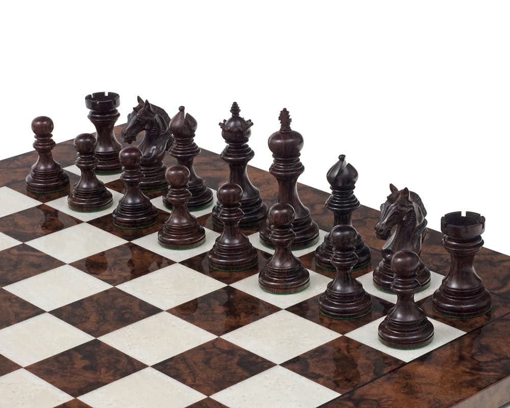 Luxury Staunton 4.25 inch Rosewood Chessmen set on chessboard, intricately carved and ornately designed, showing detailed craftsmanship