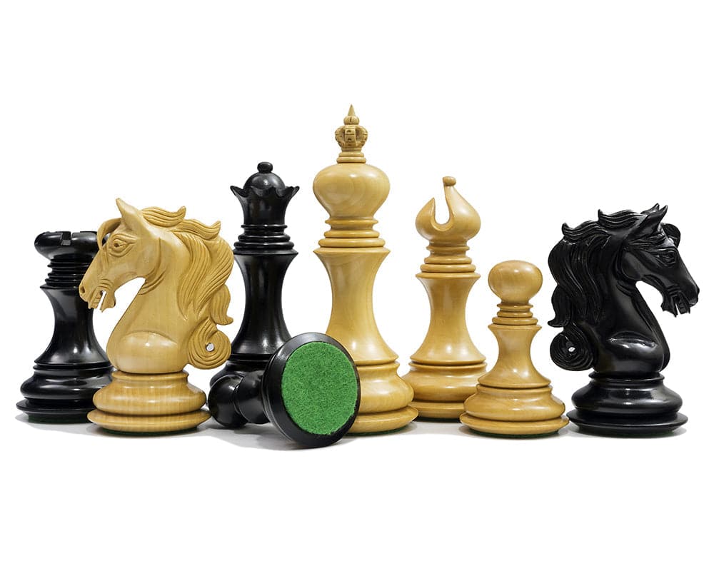 The Cavalry Series Chessmen Ebony 4.5 inch Staunton design with ornate carved knights and imposing king, handcrafted from beautiful ebony.