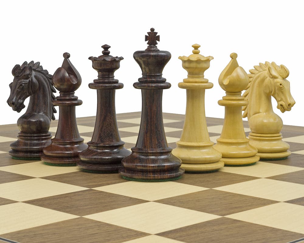 The Sheffield Knight Rosewood Chessmen on a chessboard featuring detailed 3.75 inch King, Queens, Bishops, Knights, Rooks, and Pawns.