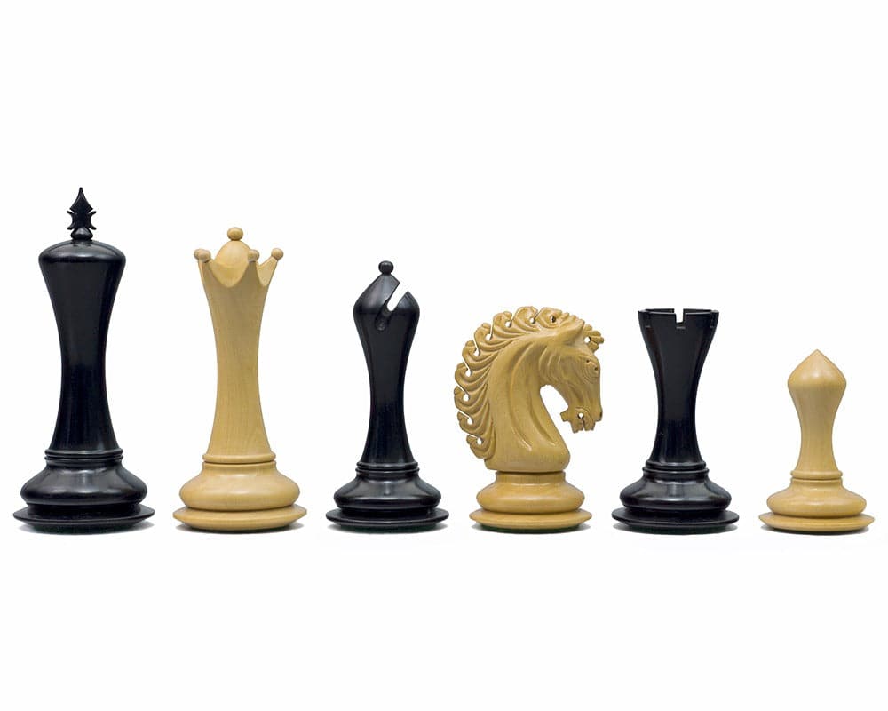 The Empire Knight Ebony Chessmen 4.5 inch, handcrafted wooden Staunton design chess pieces with two additional Queens, ornate and perfectly weighted.