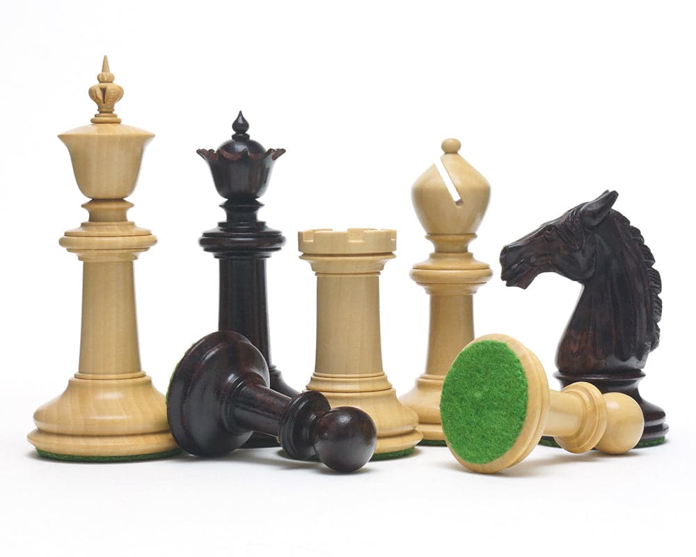 The Bath Chessmen 3.75 Inch Rosewood pieces with intricate carvings and billiard cloth bases.