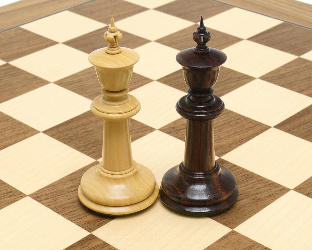 Rosewood and light wood chess kings from The Bath Chessmen 3.75 Inch set on a wooden chessboard.