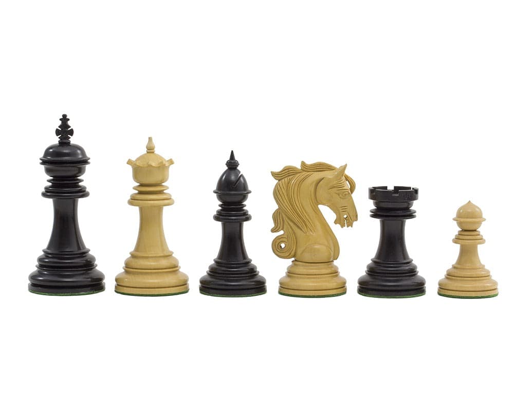 The Kingsgate Ebony Chessmen 4.25 inch set featuring intricately carved ebony and boxwood chess pieces, including the ornate knight.