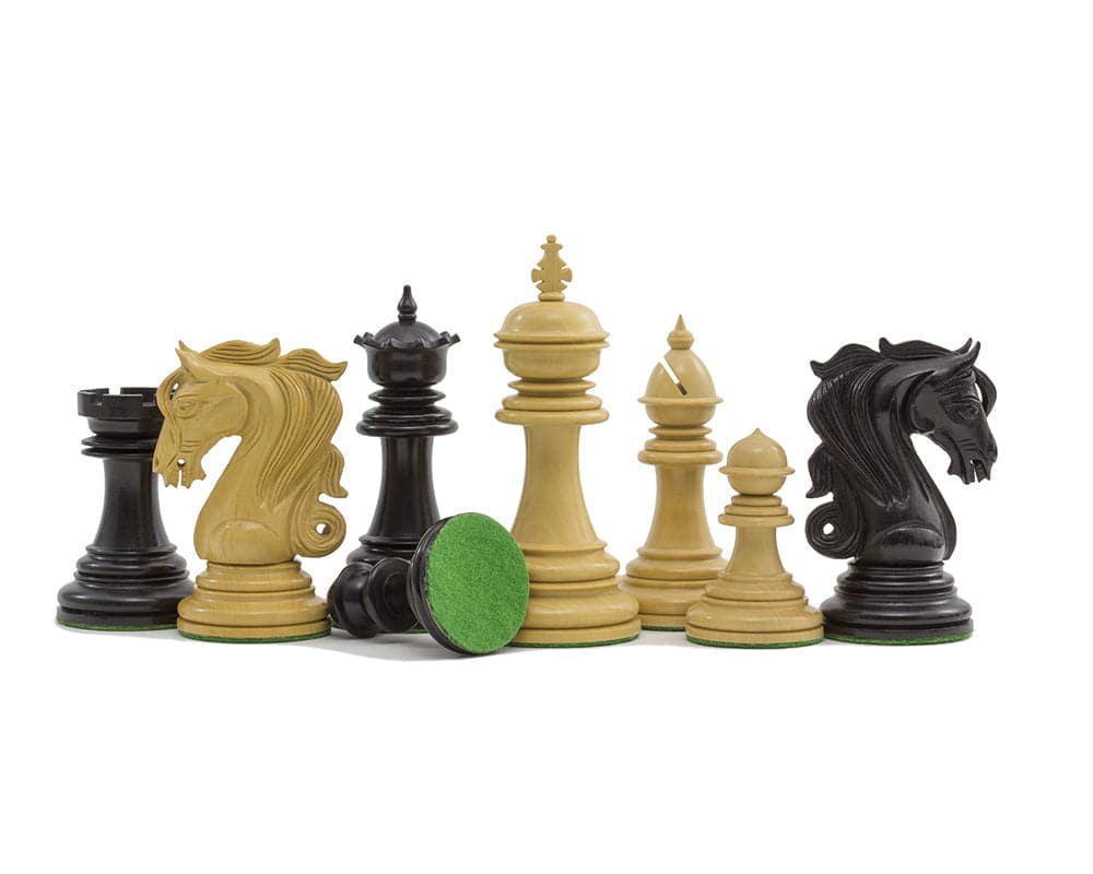 Expertly crafted Kingsgate Ebony Chessmen set with 4.25 inch King, two additional Queens, intricate knights, and billiard cloth bases.