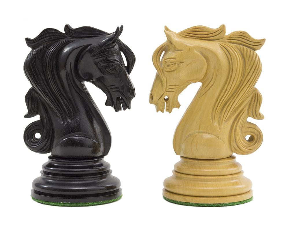 Intricately carved ebony and boxwood ornamental knight chess pieces from The Kingsgate Ebony Chessmen set.