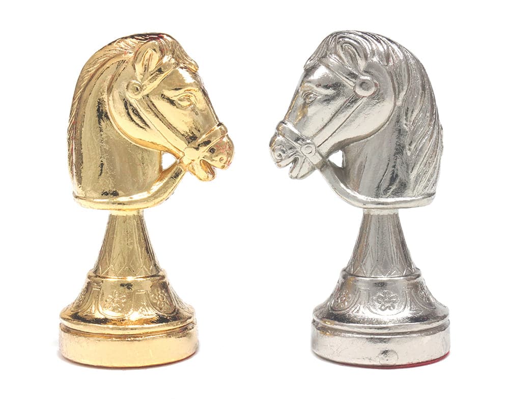 Gold and silver plated knight chess pieces from the Messina Italian Chessmen set, expertly crafted with exquisite detail.