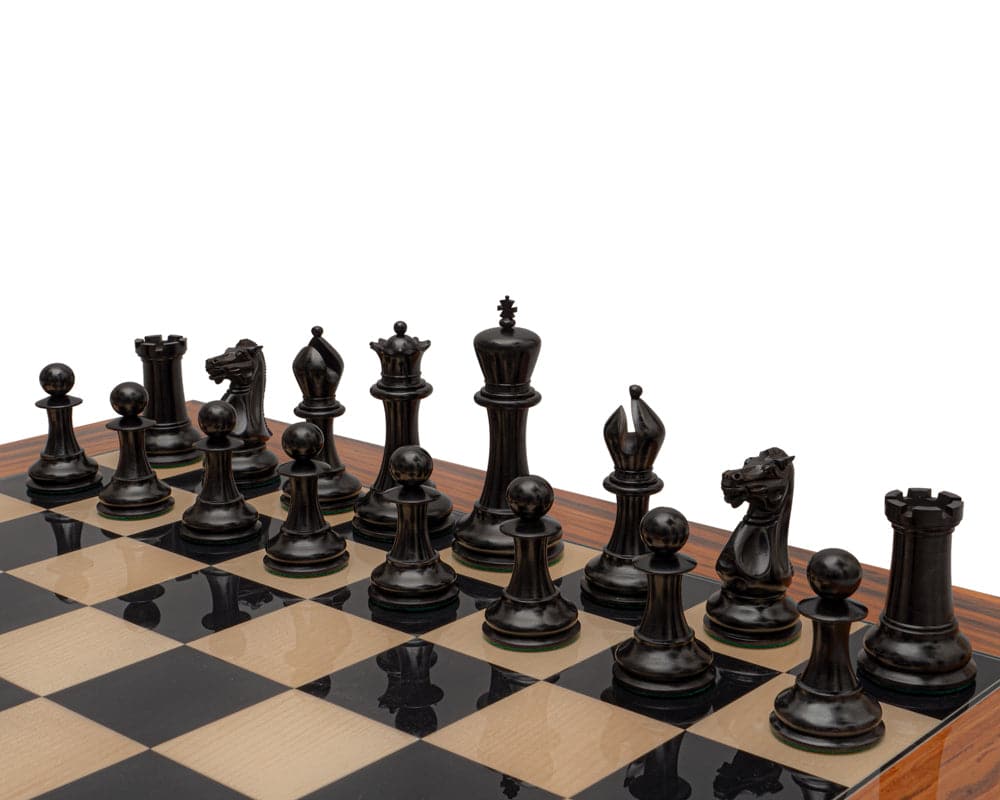 Reproduction Staunton Chessmen 1849 Model, 4.4 inch King in Ebony, set up on chessboard.