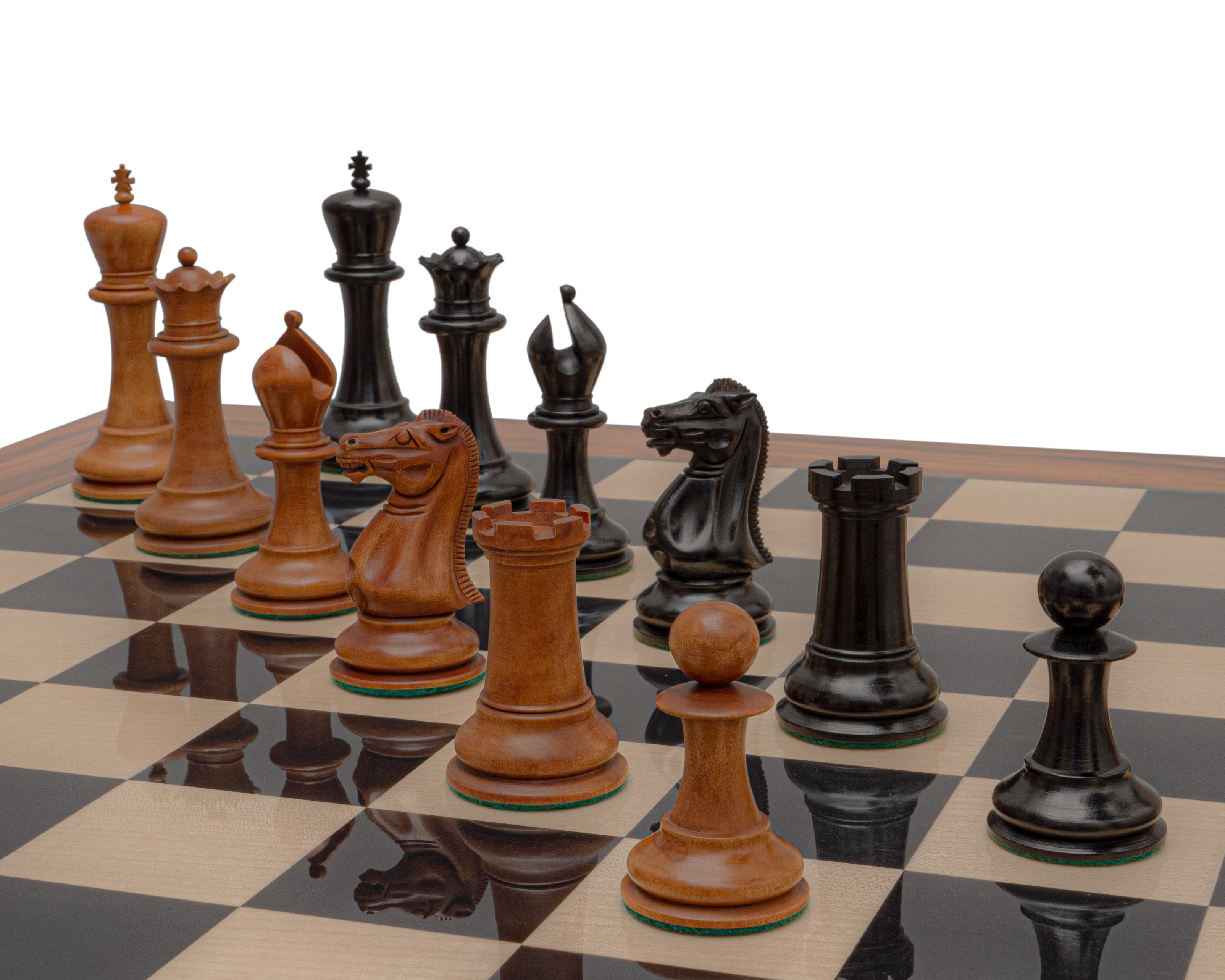 Reproduction Staunton Chessmen 1849 Model 4.4 inch King in Antiqued Boxwood and Ebony on chessboard.