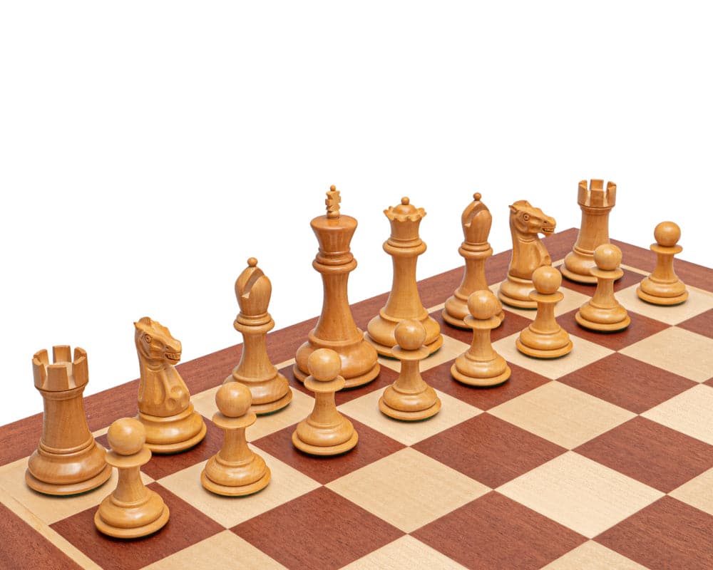 Traditional Staunton chess pieces made from boxwood, arranged on a chessboard, featuring a 3.5 inch king in the foreground.