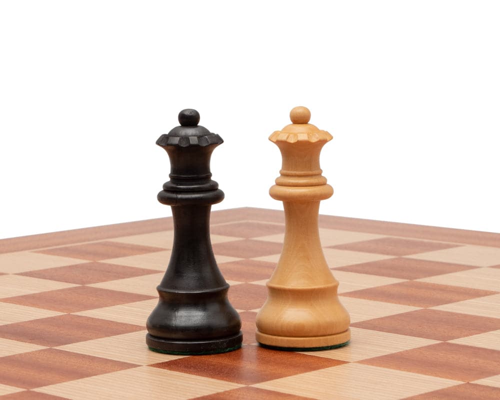 Black and white Down Head Ebonised chess pieces on a high-quality mahogany and birch veneer chessboard with 2-inch playing squares