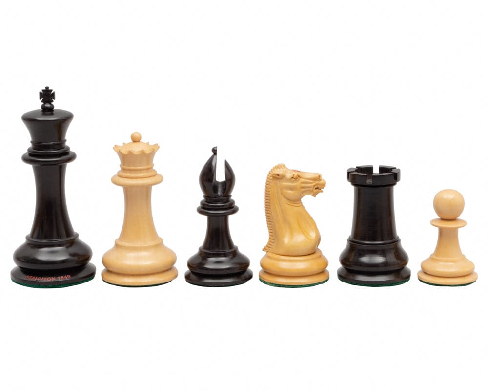 Original Staunton 1849 Ebony Chess Men 4.4 inch set with highly detailed handcrafted ebony and boxwood pieces on white background