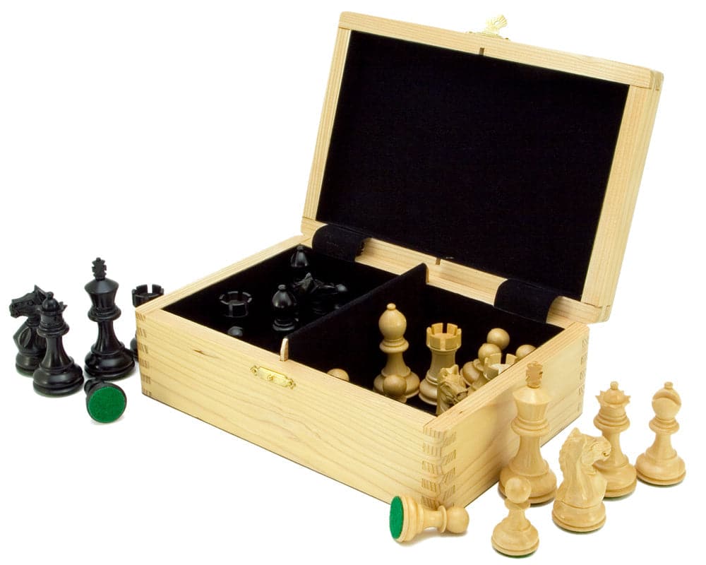 Wooden case displaying solid ebony and boxwood chess pieces from the Fierce Knight Blue Chess Set with billiard cloth bases.