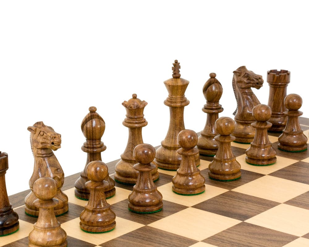 Winchester Sheesham Tournament Chess Set featuring hand carved Staunton pieces, double weighted and polished, displayed on a chessboard.