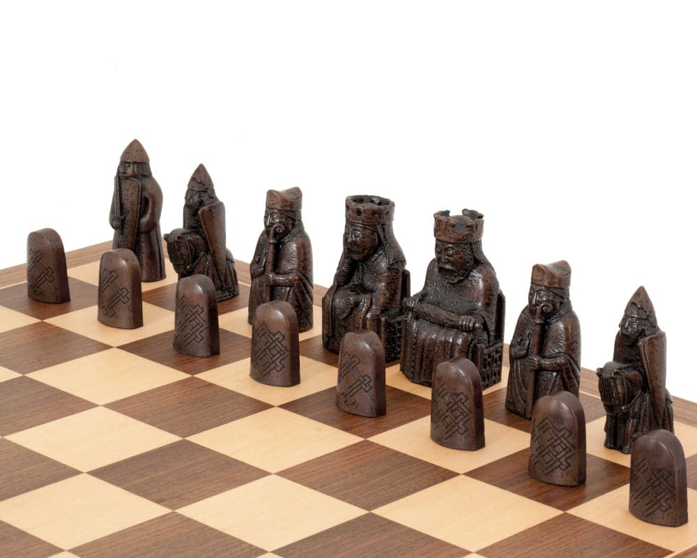 The Isle of Lewis walnut and maple chess set featuring detailed Lewis chessmen on a European walnut chess board