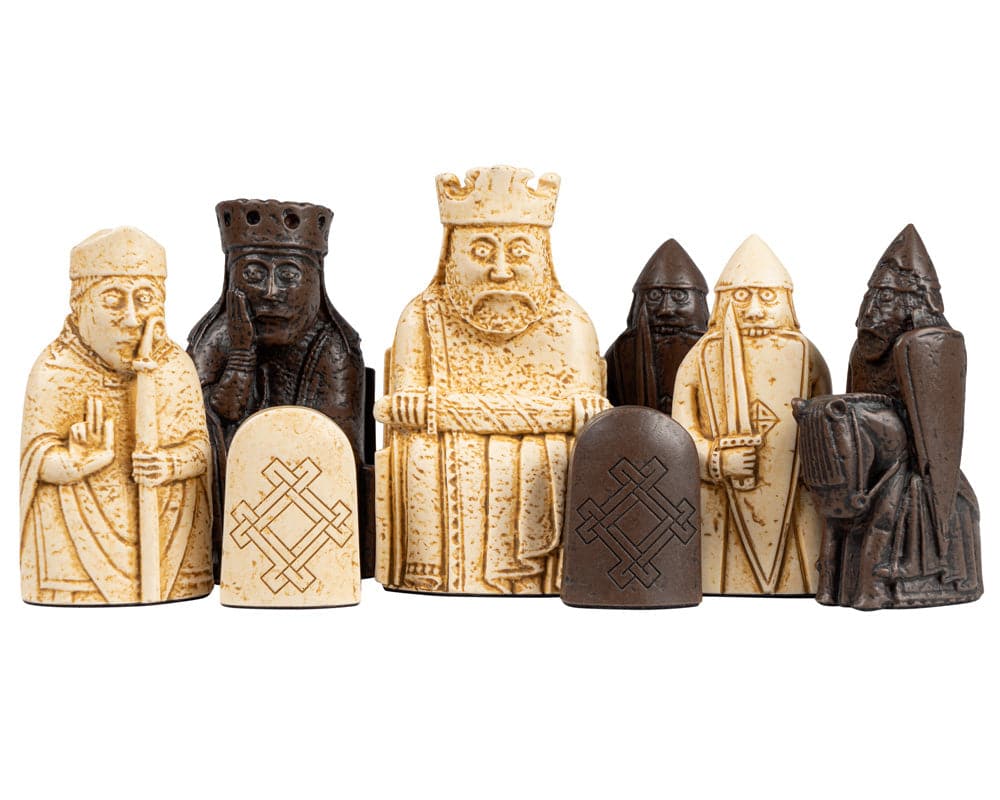 Isle of Lewis walnut and maple chess set with detailed medieval chessmen.