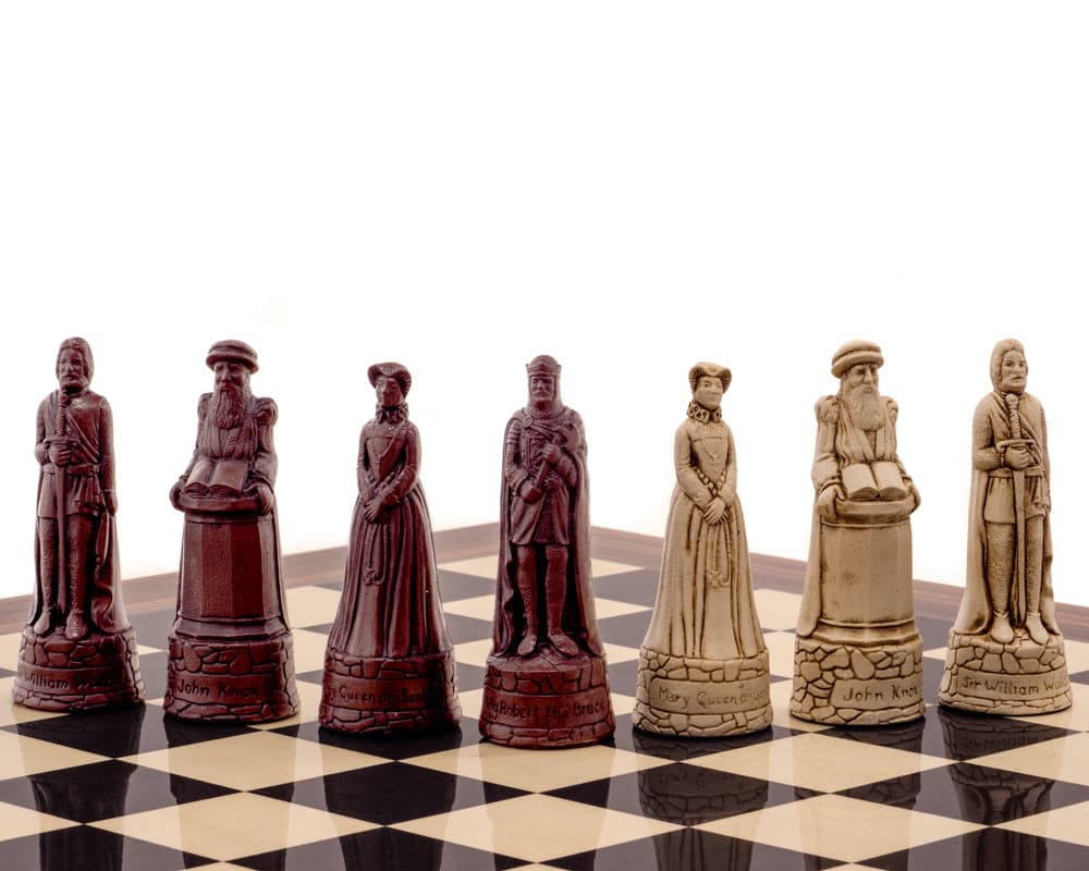 The Berkeley Chess Scottish Russet Palisander Chess Set on a black anegre and palisander deluxe board, featuring detailed historic chess pieces.