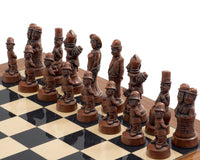 Berkeley Chess Movie Stars Metal & Palisander Grand Chess Set with intricately designed movie star themed pieces on a chessboard