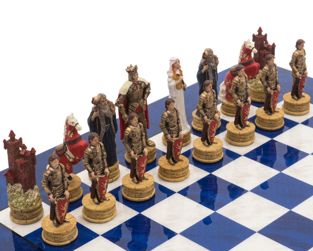 The King Arthur Hand Painted Luxury Blue Chess Set with resin pieces on a glossy blue erable and elm board.