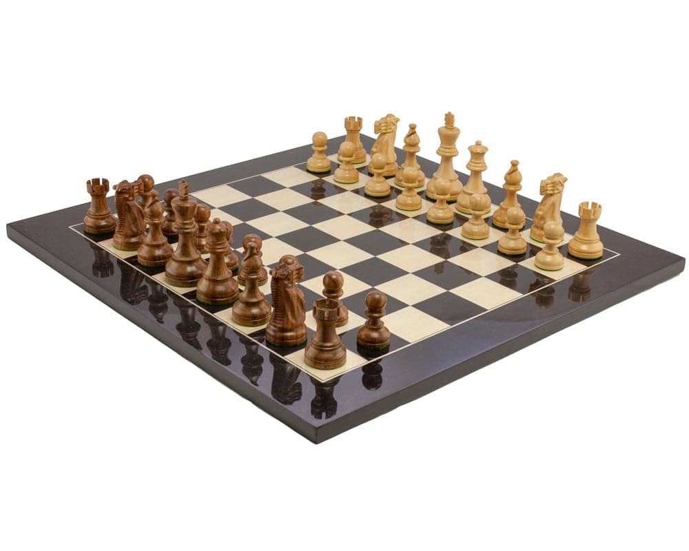 American Staunton Sheesham and Black Chess Set with intricately carved pieces on a black and white board ready for play.