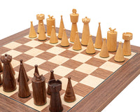 The Art Deco Sheesham and Walnut Chess Set on a 15.75â€ walnut and maple board with chic, contemporary golden rosewood and boxwood pieces.