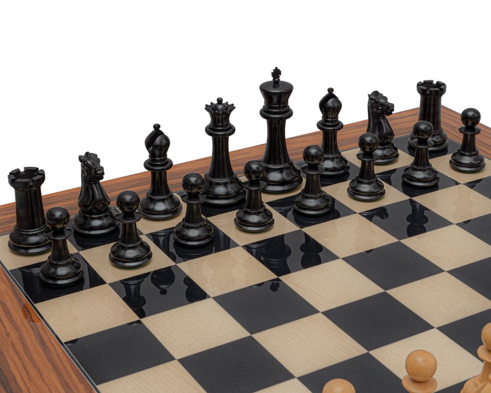 Luxury Staunton ebony and palisander chess set with ebonised boxwood pieces and a 4-inch king on a large chessboard.