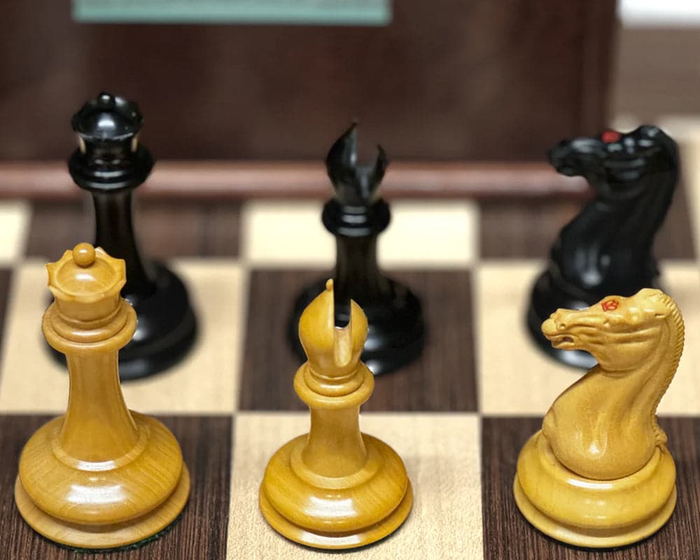 Close-up of The 1850 London Limited Edition Ebony and Mahogany Deluxe Chess set pieces on a chessboard.