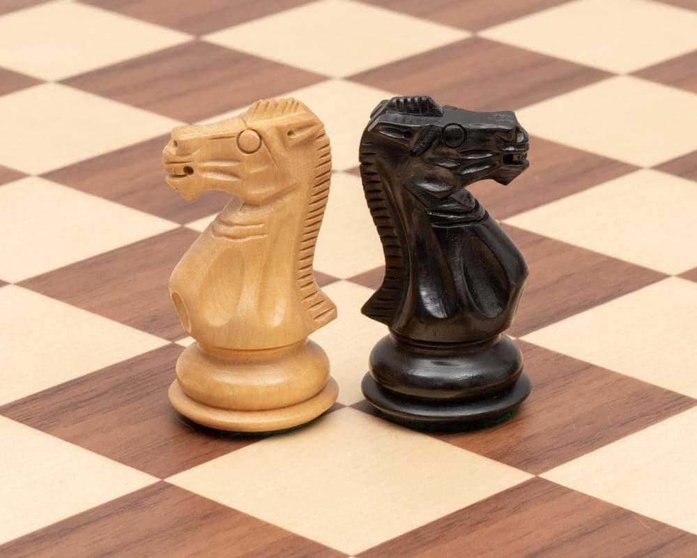 Competition Staunton Walnut Chess Set handcrafted wooden knights on a walnut and maple chessboard.